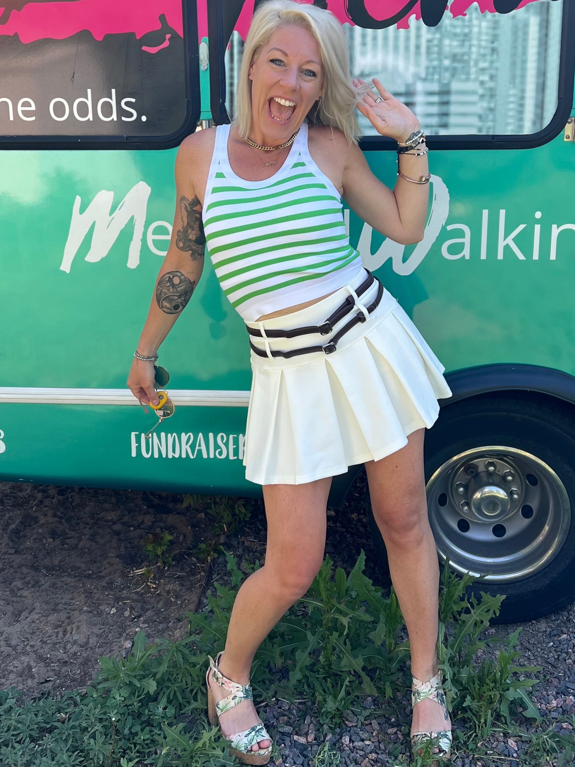 white pleated athletic skort with two belts