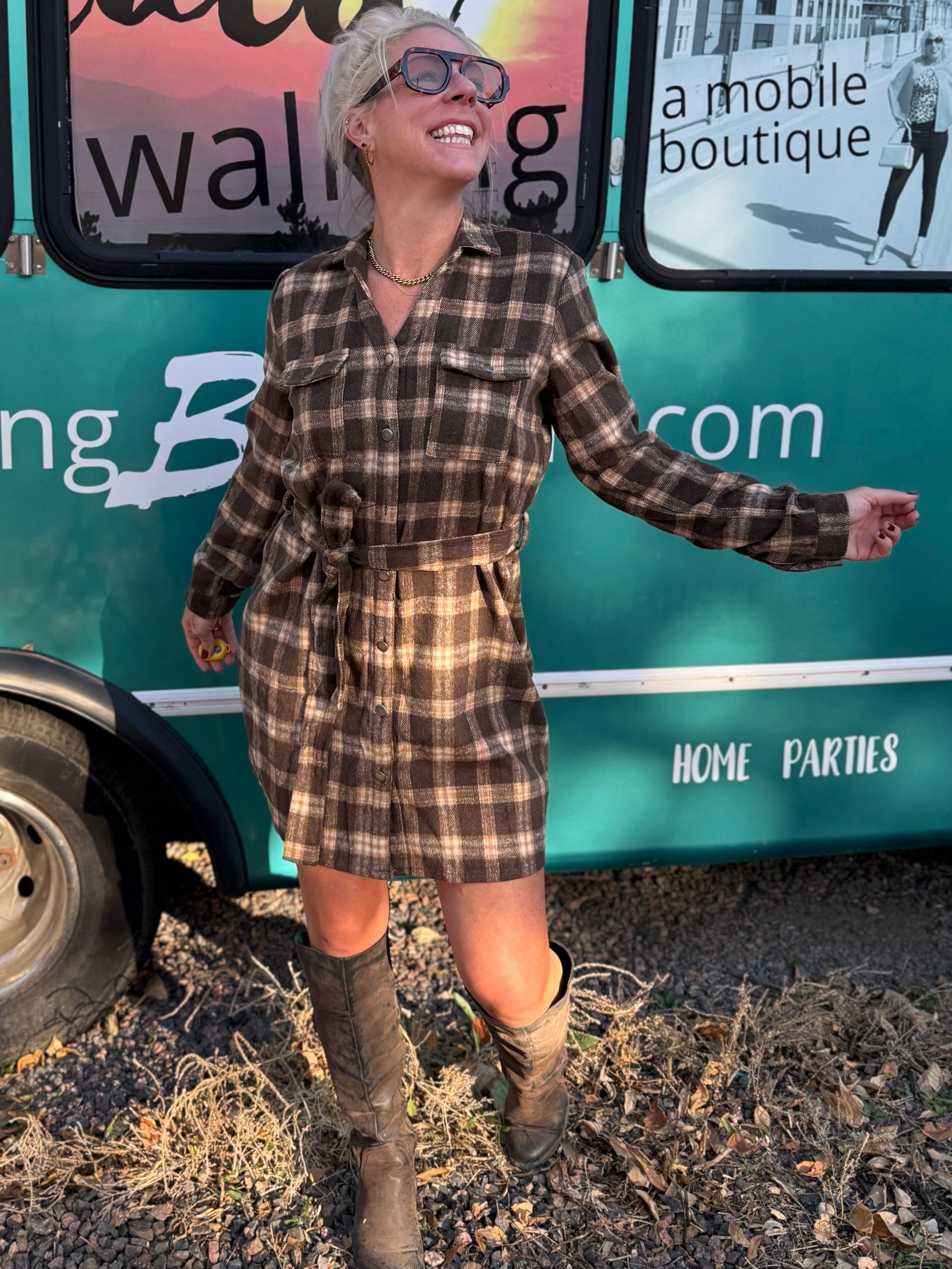 Woman standing in front of a mobile boutique truck with 'Pretty Maid Walking' branding.