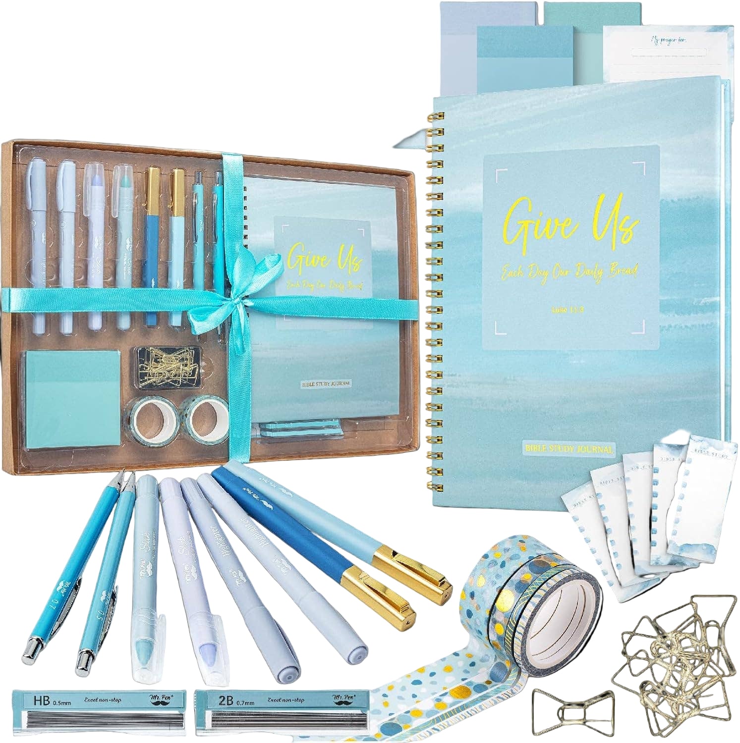 Stationery set with notebooks, pens, and decorative items on a white background