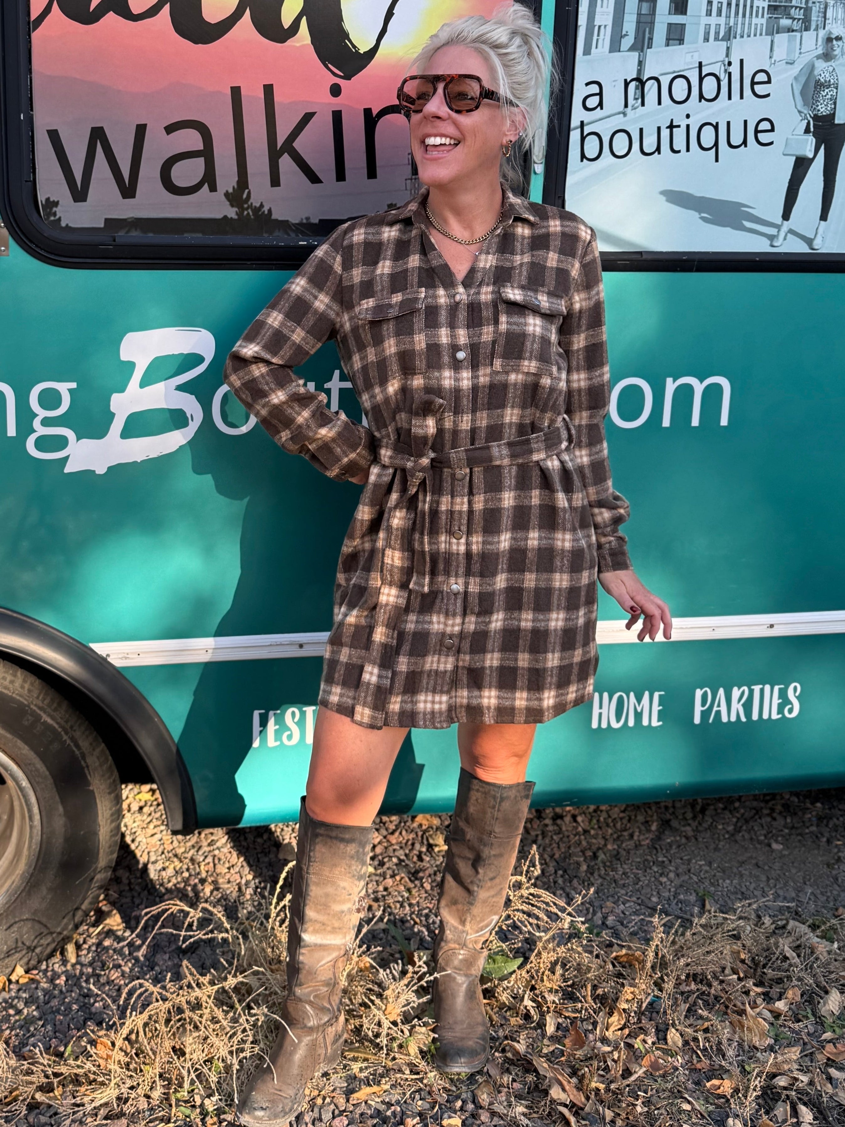 Woman standing in front of a teal mobile boutique truck with 'Mermaid Walking' branding.