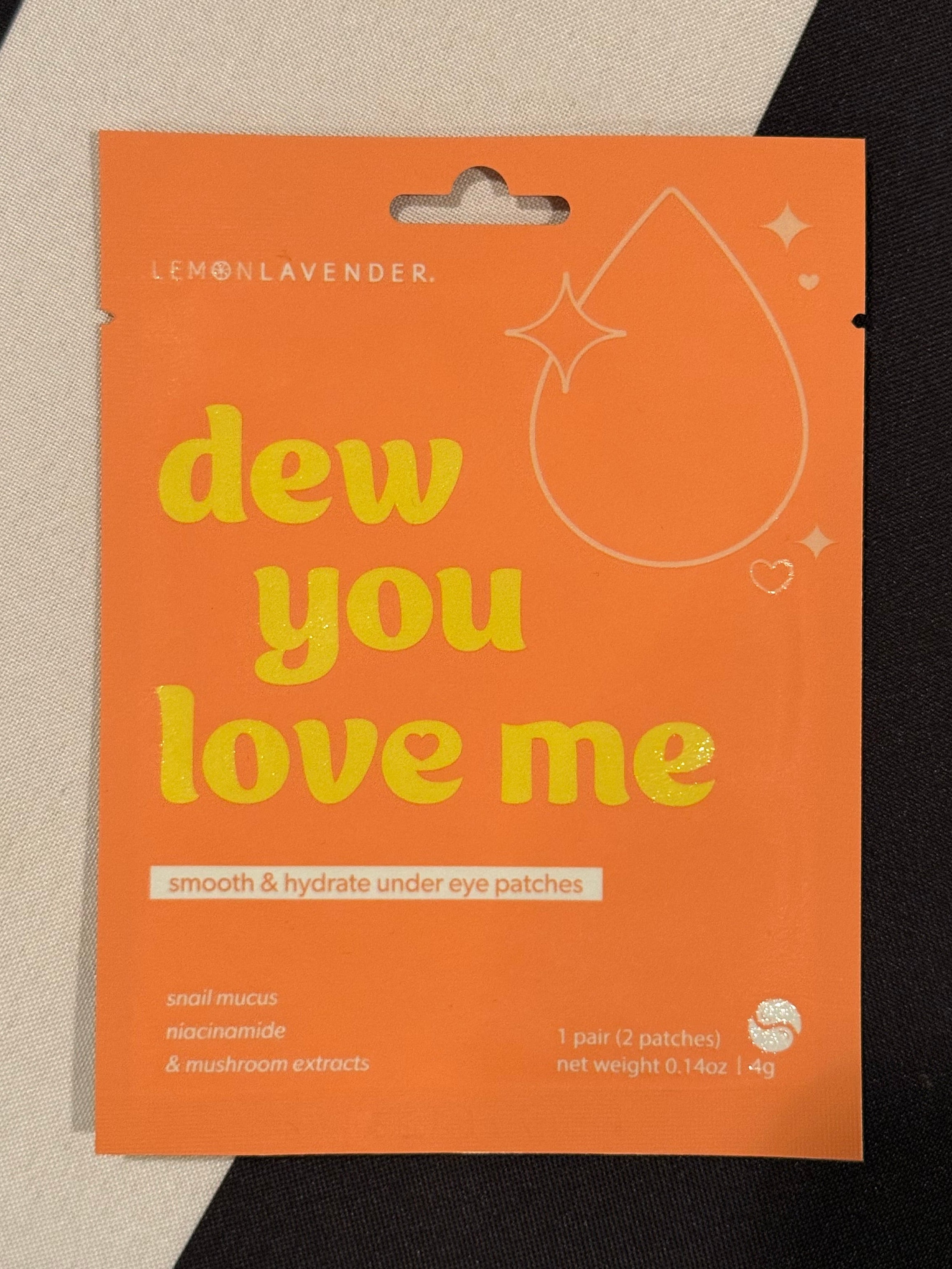 Orange product packaging with text on a geometric background