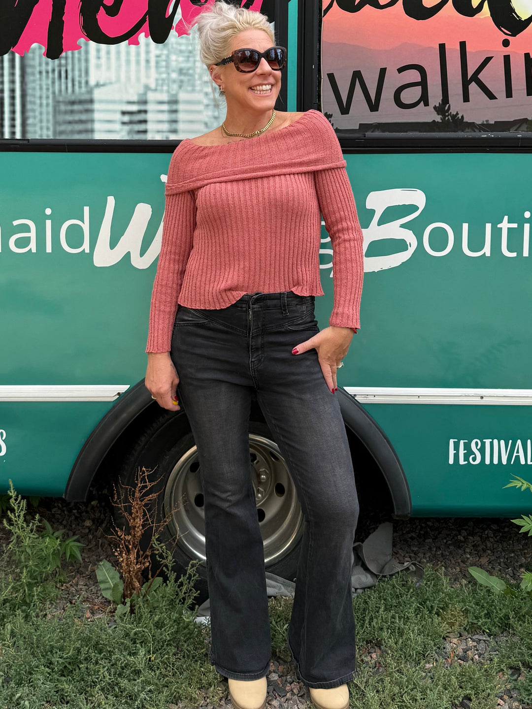 girl in front of bus
