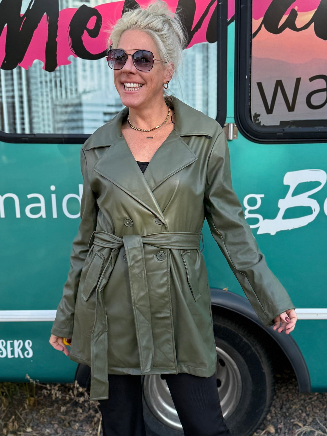 Woman standing in front of a bus with 'Mermaid Walking' branding