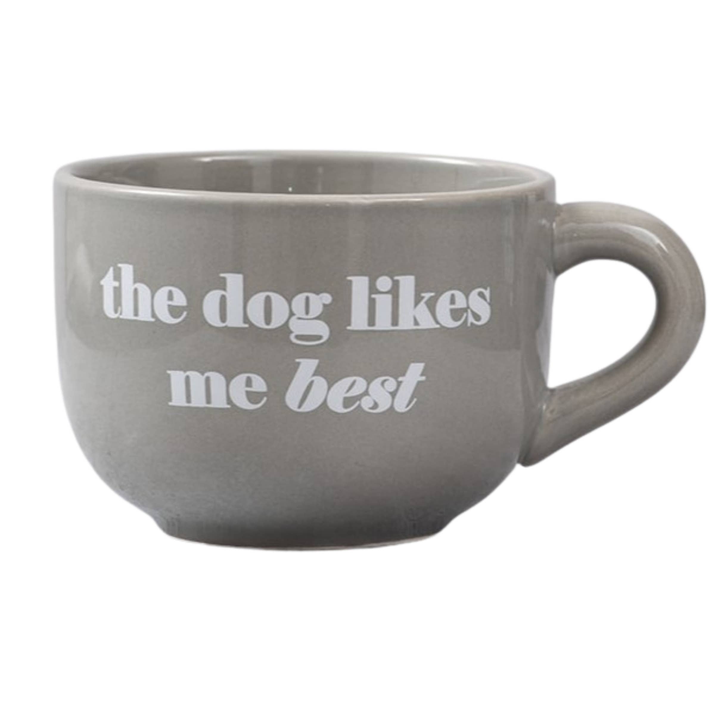 Gray mug with 'the dog likes me best' text on a white background