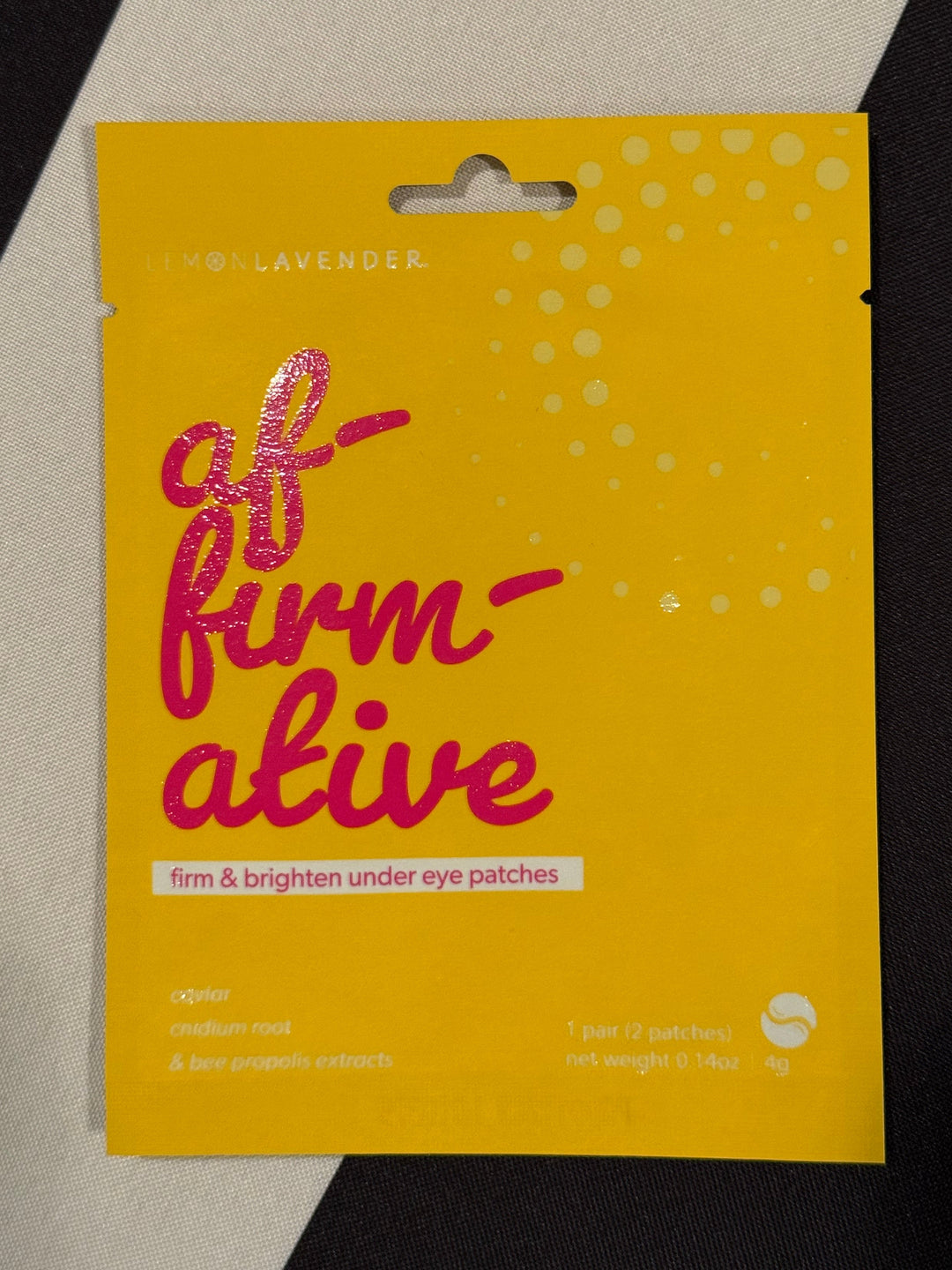 Yellow packaging with red text on a black and gray background
